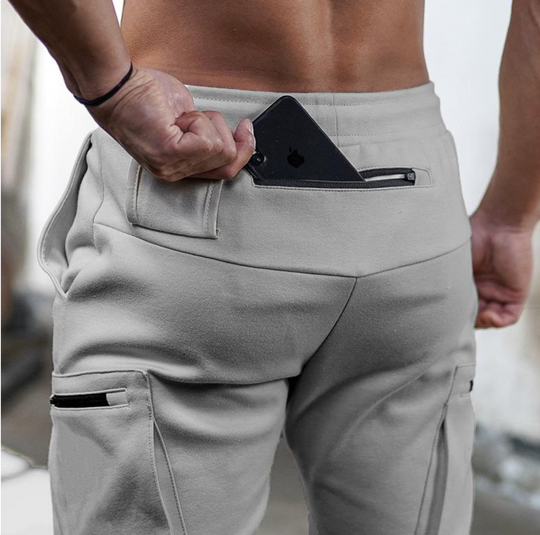 Męskie spodnie sportowe slim fit – elastyczne spodnie treningowe z kieszeniami i zamkami
